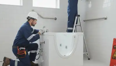 Spokane, WA plumber installing a walk-in tub for safer home bathing in cold-weather homes